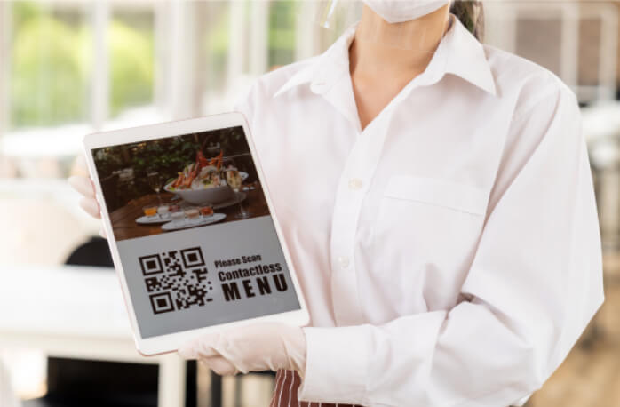 Woman showing a hospitality app