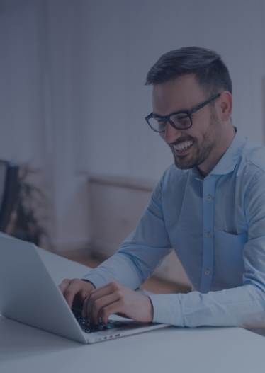 Man in insurance working on laptop
